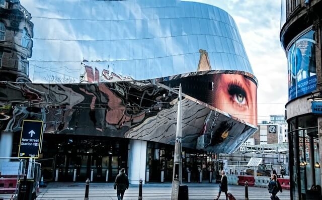 Reflective shopping mall with screen in Birmingham