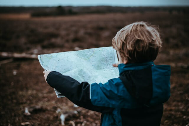 Young child looking at a map