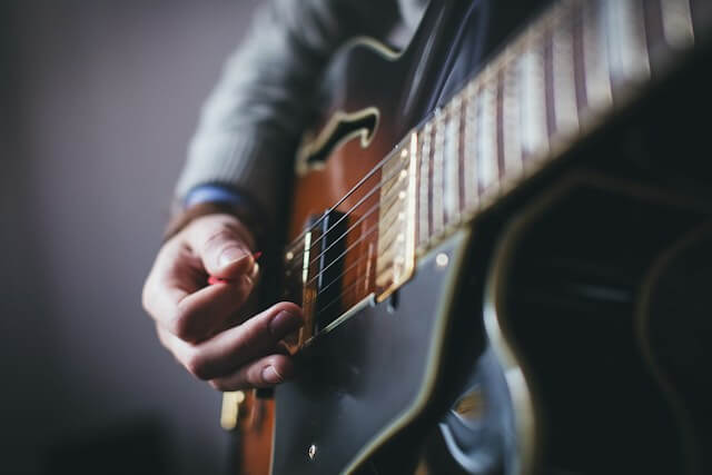 A person playing a guitar