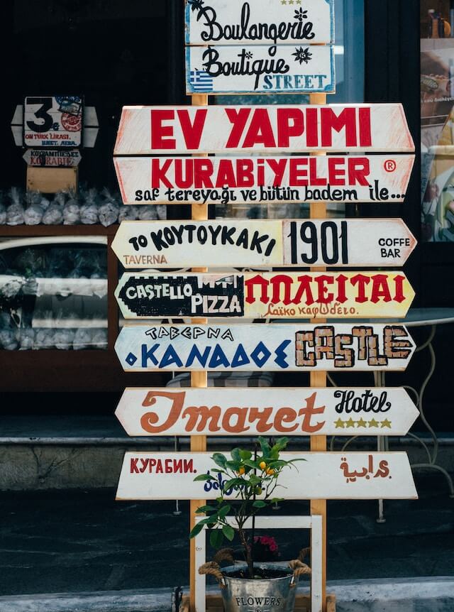 A signpost with different languages on it